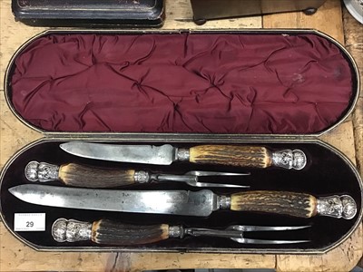 Lot 29 - Victorian four piece carving set with silver mounts and stag antler handles, in original fitted case