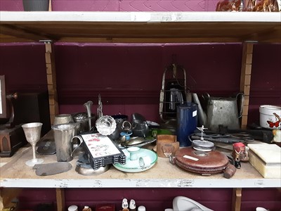 Lot 501 - Two shelves of mixed metal ware including an oil lamp, enamel candle holders and other sundries