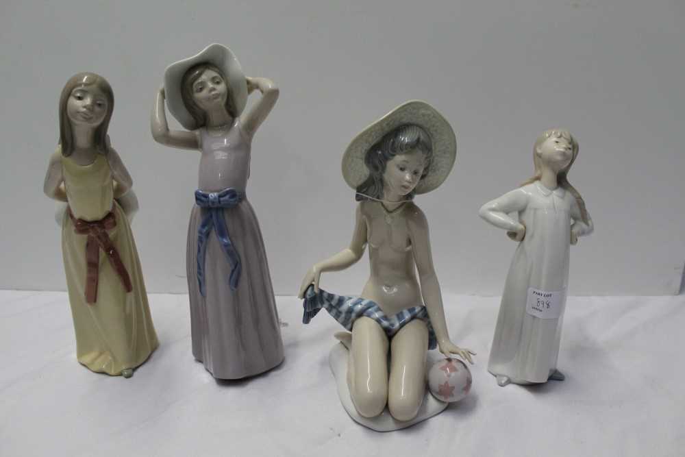 Lot 193 - Four Lladro figures, between 20cm and 26cm height