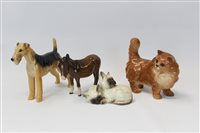 Lot 2163 - Four Beswick models - donkey, cat, dog and...