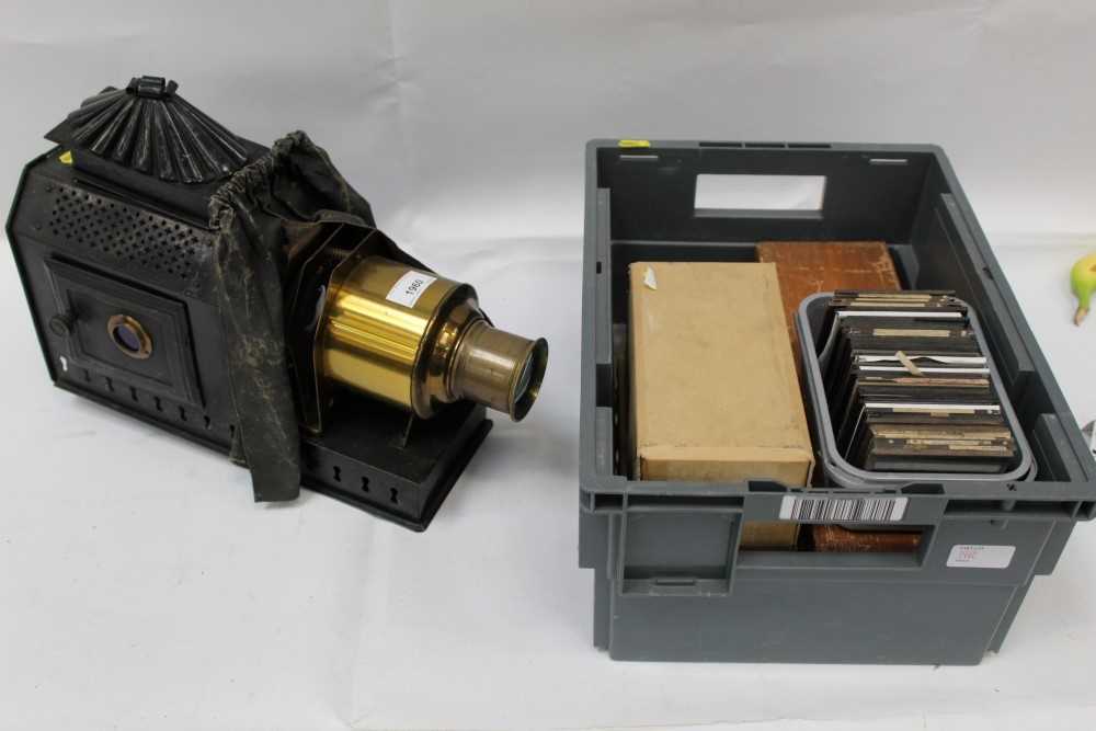 Lot 1960 - Antique magic lantern with a collection of glass lantern slides