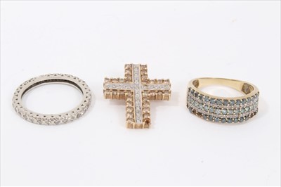Lot 25 - Diamond full band eternity ring, blue and white diamond band ring and a cinnamon diamond and white diamond cross pendant