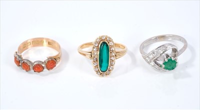 Lot 458 - Antique carved coral ring, rose cut diamond and synthetic green stone ring and a 18ct white gold emerald and diamond cluster ring(3)