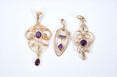 Lot 389 - Three Edwardian Art Nouveau gold and amethyst pendants