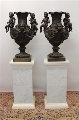 Lot 1324 - Impressive pair of classical style bronze urns, on marbled pedestals