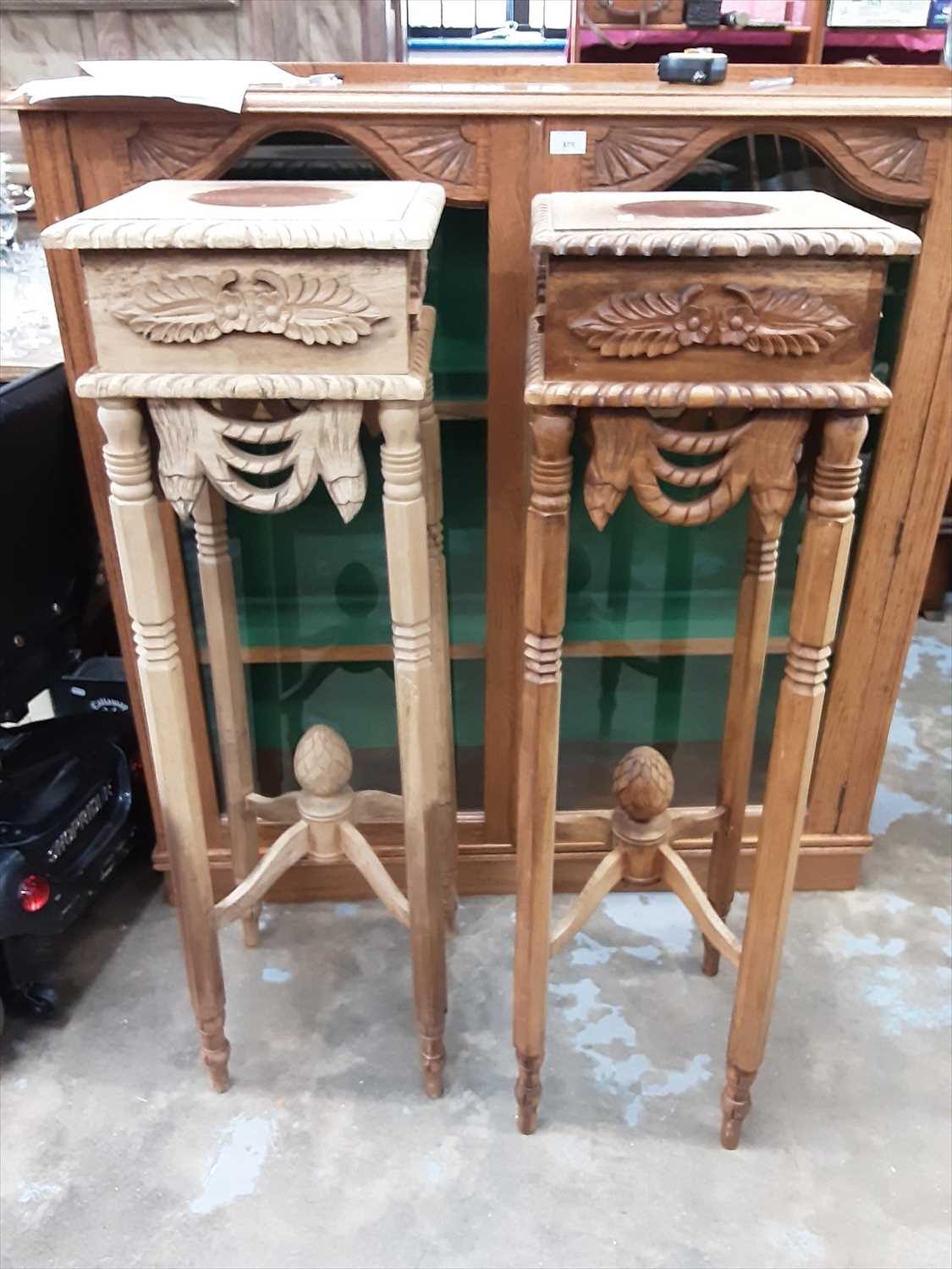 Lot 1005 Pair of carved wood urn stands