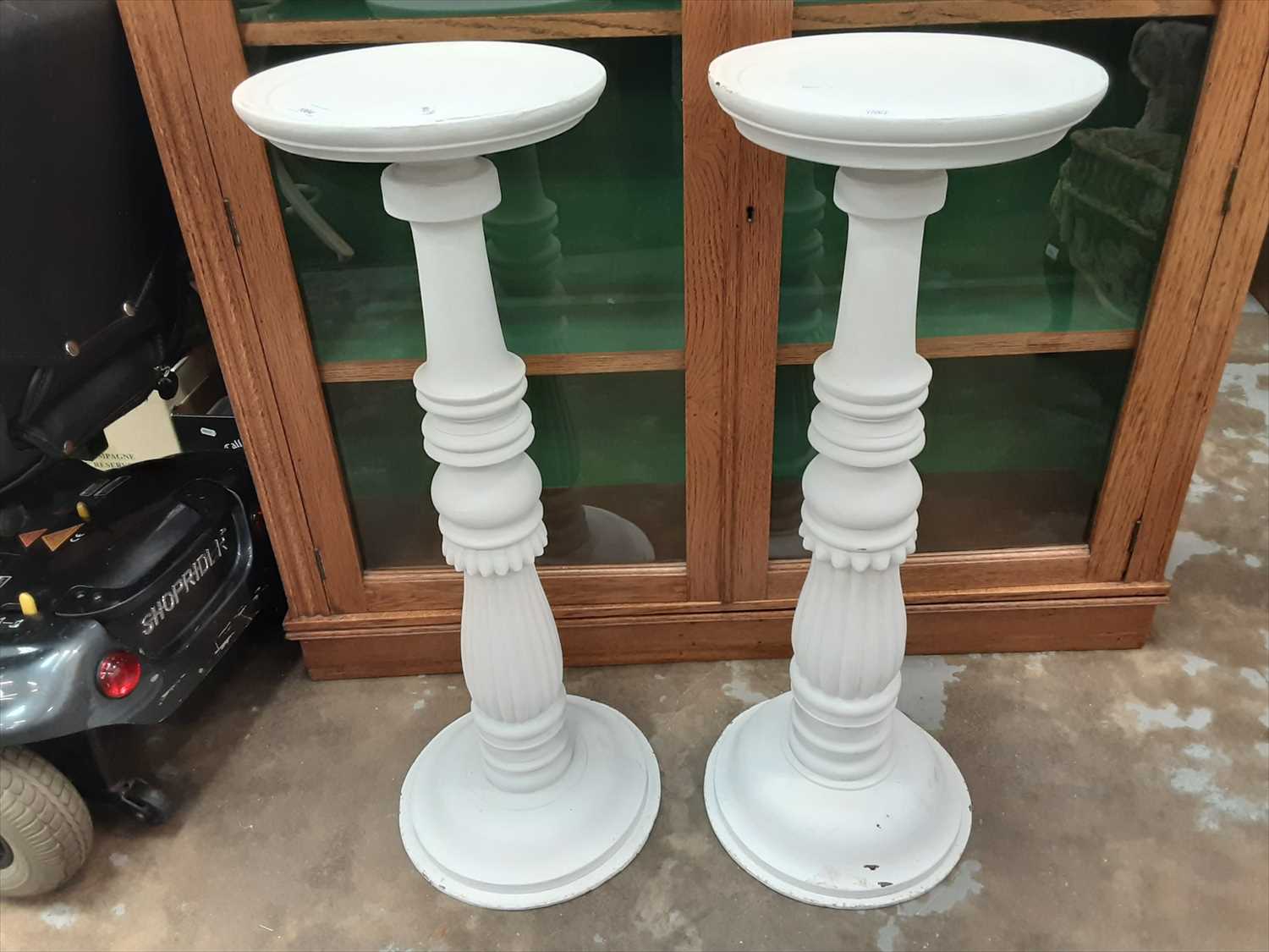 Lot 1004 - Pair of white painted torchère stands