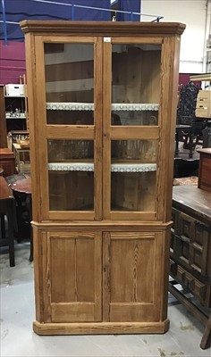 Lot 934 - 19th century pine two height corner cupboard with two glazed doors above enclosing two fixed shelves and two panelled doors below on plinth base