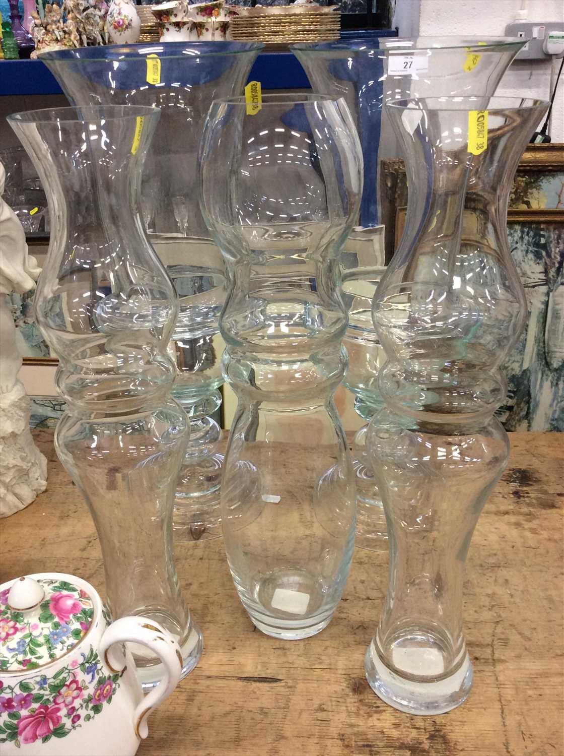 Lot 27 - Pair of glass storm lamps and suite of three vases