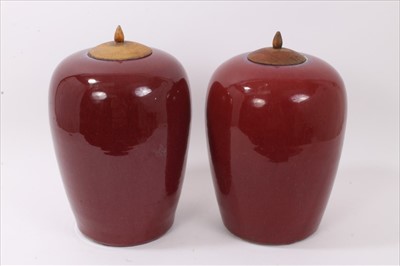 Lot 151 - Large pair of antique Chinese flambé glazed melon jars with wooden lids