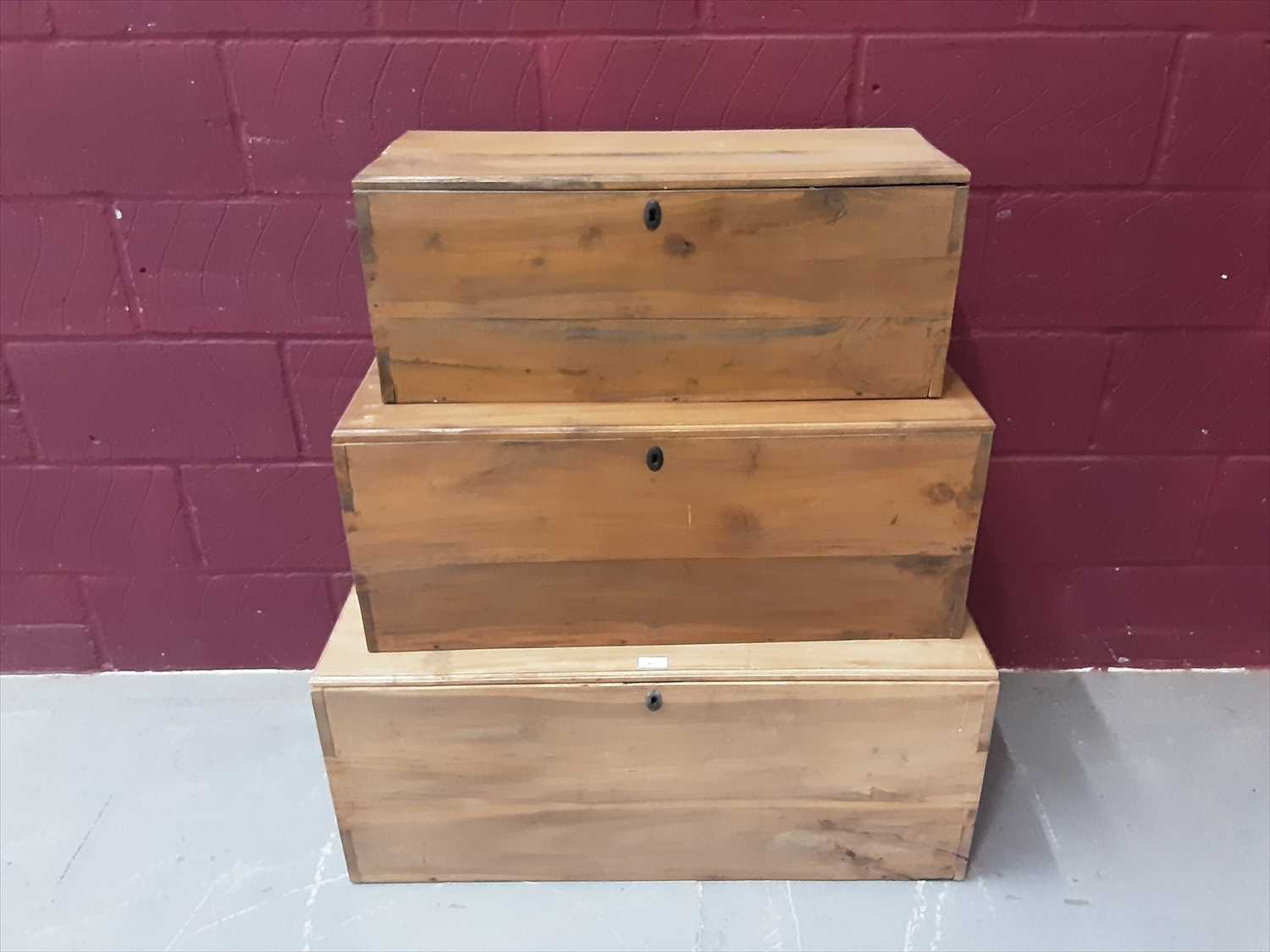 Lot 855 - Nest of three teak chests with metal side handles