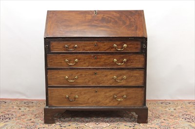 Lot 1319 - George III flame mahogany bureau