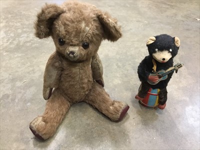 Lot 154 - Vintage mohair teddy bear, together with a clockwork toy guitar playing bear. (2)