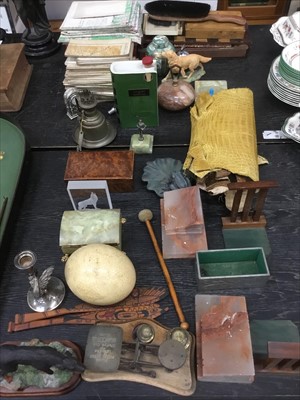 Lot 155 - Miscellaneous items including ostrich egg, cloth folding maps, treen and carved stone itens