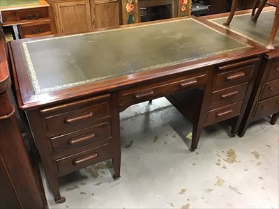 Lot 937 - Mid 20th century mahogany twin pedestal desk with tooled green leather insert top, two brushing slides below and an arrangement of seven drawers standing on square tapered legs