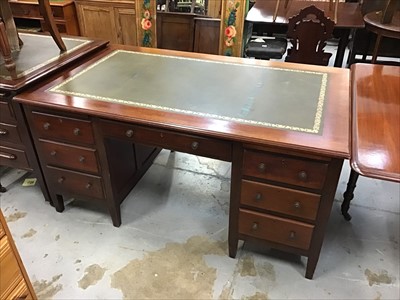 Lot 938 - Early 20th century mahogany twin pedestal desk with tooled green leather insert top with two brushing slides and an arrangement of seven drawers below standing on short square tapered legs