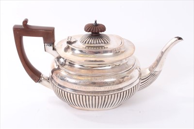 Lot 234 - Late Victorian silver teapot of half fluted form.