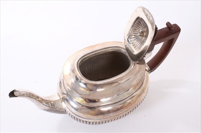 Lot 234 - Late Victorian silver teapot of half fluted form.