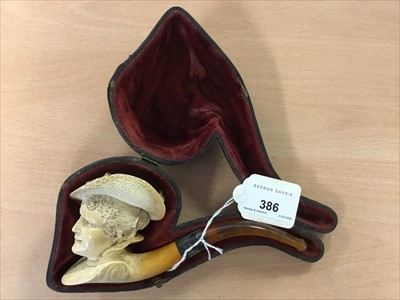 Lot 386 - Early 20th century carved meerschaum pipe, the bowl carved as the head of a smiling young lady, with silver collar (Birmingham 1916), cased