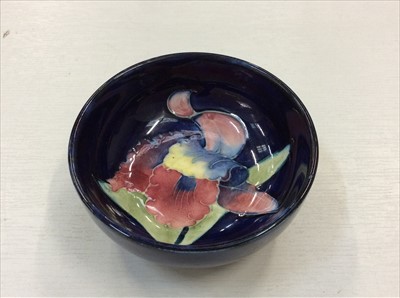 Lot 461 - Moorcroft small pottery bowl with iris decoration on blue ground