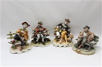 Lot 2199 - Four Capodimonte figures - Tramps on benches