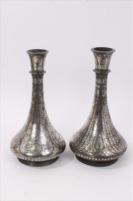 Lot 781 - Pair of Islamic silver inlaid vases