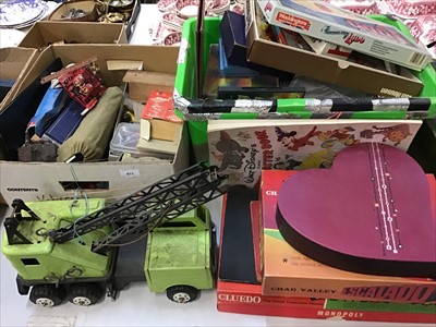 Lot 473 - Quantity toys and games including two wooden boats, puzzles, metal crane etc