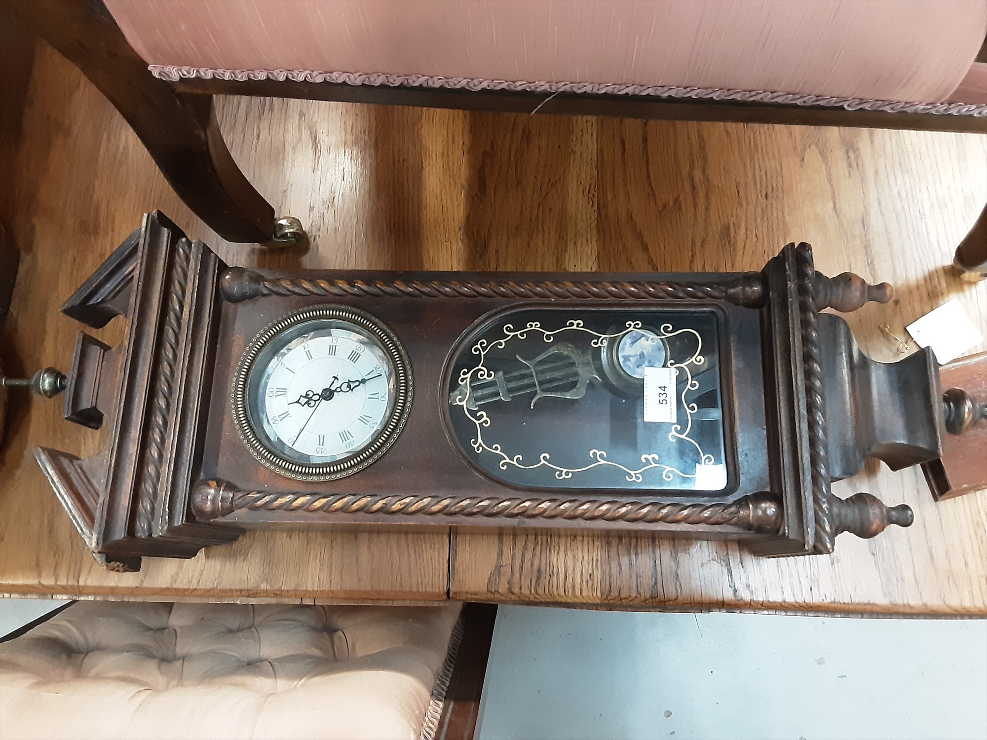 Lot 202 Wooden wall clock with pendulum