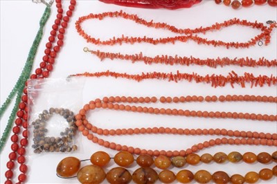 Lot 14 - Group amber type bead necklaces, simulated cherry amber, vintage coral jewellery, other beads and red resin model of galloping horses