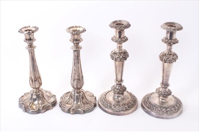Lot 263 - Two pairs of 19th century silver plate candlesticks.
