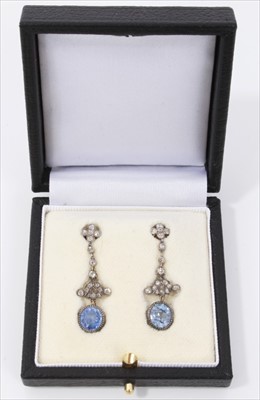 Lot 455 - Pair of sapphire and diamond pendant earrings, each with an oval mixed cut natural Ceylon sapphire suspended from a pendant mount with old cut and rose cut diamonds in mille grain and collet settin...