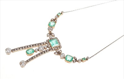 Lot 395 - Art Deco style emerald and diamond negligée pendant necklace, the central cluster with a rectangular step cut emerald suspending an old cut diamond and oval cut emerald drop, flanked by two pendant...