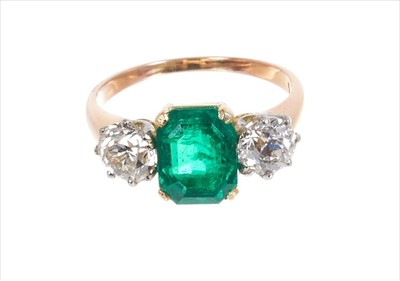 Lot 373 - Emerald and diamond three stone ring with a central octagonal cut emerald weighing 2.13cts flanked by two old cut diamonds in claw setting on gold shank. Accompanied by a Gemmological Certification...