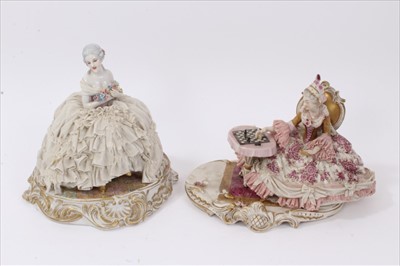Lot 122 - Two early 20th century Continental porcelain 'lace' figures of ladies