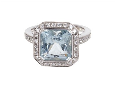 Lot 376 - Aquamarine and diamond ring with sapphire gallery