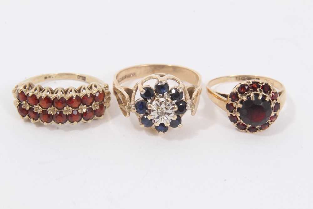 Lot 36 - 9ct gold sapphire cluster ring and two gold garnet rings (3)