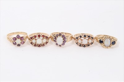 Lot 37 - Five 9ct gold opal and gem set cluster rings