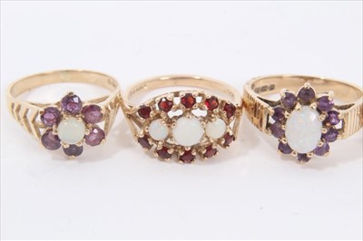 Lot 37 - Five 9ct gold opal and gem set cluster rings