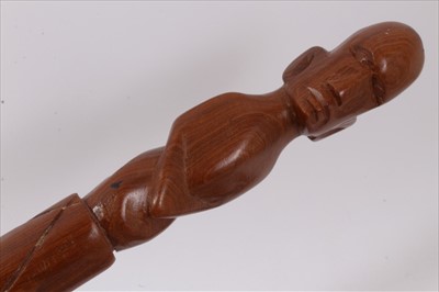 Lot 734 - 19th century carved hardwood tribal stick, together with three further carved wooden sticks