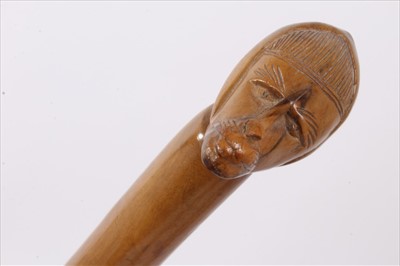Lot 734 - 19th century carved hardwood tribal stick, together with three further carved wooden sticks