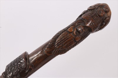 Lot 734 - 19th century carved hardwood tribal stick, together with three further carved wooden sticks
