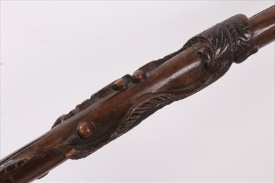 Lot 734 - 19th century carved hardwood tribal stick, together with three further carved wooden sticks