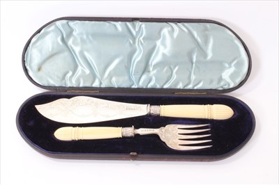 Lot 321 - Cased pair of Victorian silver fish servers with ivory handles