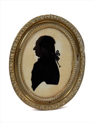 Lot 775 - Charles Rosenberg (1745-1844) silhouette miniature reverse painting on glass of a Gentleman - possibly George III, original trade label verso, oval, 10 x 7cm, in pressed brass frame