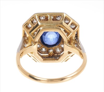 Lot 361 - Art Deco style sapphire and diamond cocktail ring with a central oval mixed cut blue sapphire surrounded by two concentric octagonal borders of old cut and brilliant cut diamonds in platinum mille...