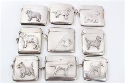 Lot 300 - Collection of fifteen Victorian and later silver vesta cases decorated in relief with dogs and cats (15)
