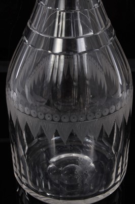 Lot 107 - Early 19th century cut glass decanter, of ovoid form with facet-cut decoration, etched circle and swag pattern around the middle, and a lozenge-shape stopper, 31cm height