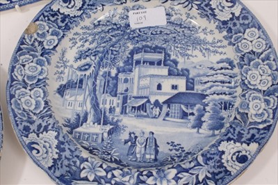 Lot 109 - Early 19th century Staffordshire blue and white transfer printed platter, decorated with an Oriental scene, and a pair of plates with matching pattern (3)