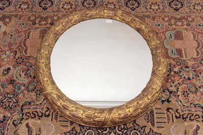 Lot 1334 - Continental carved gilt wood wreath framed wall mirror