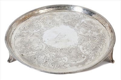 Lot 323 - George III silver tray of circular form with beaded border by Hester Bateman.